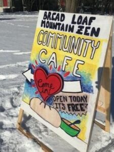 Sign reading "Bread Loaf Mountain Zen Community Cafe"