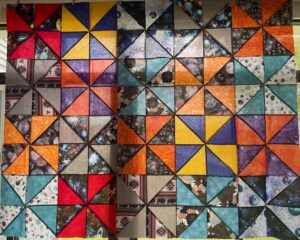 Multicolored quilt with triangles