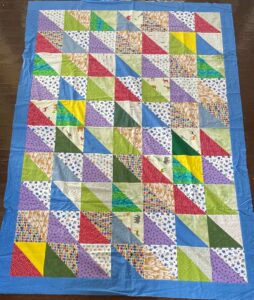 Multicolored quilt with triangles